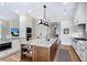 Modern kitchen featuring an island with seating, built-in appliances, and hardwood floors at 4 Falcon Point Rd, Kiawah Island, SC 29455