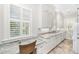 Functional laundry room featuring custom cabinets, granite countertops, and a built-in desk space at 4 Falcon Point Rd, Kiawah Island, SC 29455