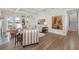 Open-concept living room boasting large windows, hardwood floors, and a staircase, perfect for entertaining at 4 Falcon Point Rd, Kiawah Island, SC 29455