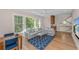 Living room with white sofa, big windows, and a light blue rug at 4 Falcon Point Rd, Kiawah Island, SC 29455