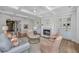 Elegant living room features a fireplace, built-in shelving, and hardwood floors for a classic look at 4 Falcon Point Rd, Kiawah Island, SC 29455