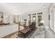 Comfortable living area with large windows, hardwood floors, and views of the outdoor landscape at 4 Falcon Point Rd, Kiawah Island, SC 29455