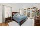 This bedroom features a large bed, bedside tables, and French doors leading to a private balcony at 4 Falcon Point Rd, Kiawah Island, SC 29455