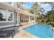 Gorgeous outdoor pool area with a covered porch for entertaining and lounging on a sunny day at 4 Falcon Point Rd, Kiawah Island, SC 29455