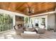 Comfortable screened-in porch with fireplace and wooded views at 4 Falcon Point Rd, Kiawah Island, SC 29455