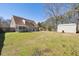 Expansive backyard with a metal shed and a screened in patio perfect for relaxing and entertaining at 404 Terrier Rd, Goose Creek, SC 29445