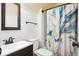Cozy bathroom featuring an ornate shower curtain, modern sink, and traditional design elements at 404 Terrier Rd, Goose Creek, SC 29445