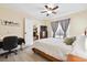 Comfortable bedroom with a ceiling fan, natural light and work space, creating a serene atmosphere at 404 Terrier Rd, Goose Creek, SC 29445