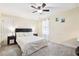Comfortable bedroom featuring a ceiling fan, neutral tones, and plush carpeting at 404 Terrier Rd, Goose Creek, SC 29445