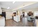 Open kitchen with white cabinetry, modern appliances, seamlessly connects to the dining and living spaces at 404 Terrier Rd, Goose Creek, SC 29445