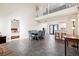 Open concept living space with high ceilings, tile flooring, and seamless flow to the kitchen and dining area at 404 Terrier Rd, Goose Creek, SC 29445
