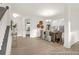 Elegant dining area with natural light, stylish chandelier, and easy access to the staircase at 409 Avocet Dr # 553P, Summerville, SC 29486