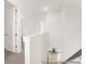 Hallway features a staircase with stylish railings and views to the rooms below at 409 Avocet Dr # 553P, Summerville, SC 29486