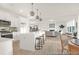 Modern, open kitchen features white cabinets, stainless appliances, and large center island at 409 Avocet Dr # 553P, Summerville, SC 29486