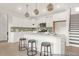 Bright kitchen with white cabinets, stylish pendant lighting, and stainless steel appliances at 409 Avocet Dr # 553P, Summerville, SC 29486