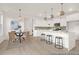 Well-lit kitchen with stainless appliances, large island, and adjacent dining area at 409 Avocet Dr # 553P, Summerville, SC 29486