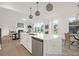 Open kitchen with large island, stainless steel appliances, and seamless access to the dining area at 409 Avocet Dr # 553P, Summerville, SC 29486