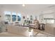Inviting living room with large windows, comfortable seating, and seamless access to kitchen at 409 Avocet Dr # 553P, Summerville, SC 29486