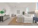 Airy main bedroom boasts natural light and a relaxing seating area with a decorative rug at 409 Avocet Dr # 553P, Summerville, SC 29486