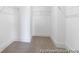 Bright walk-in closet featuring carpeted floors and ample shelving for optimal organization and storage at 409 Avocet Dr # 553P, Summerville, SC 29486