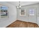 Bright dining area with natural light, modern light fixture, and wood-look flooring at 415 Parkdale Dr # 12 A, Charleston, SC 29414