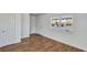 Light-filled entryway with wood-look floors, freshly painted white walls, and natural light from window at 415 Parkdale Dr # 12 A, Charleston, SC 29414