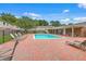Community swimming pool surrounded by lounge chairs and a brick patio area for relaxation and socializing at 415 Parkdale Dr # 12 A, Charleston, SC 29414