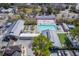 Aerial view of a community pool surrounded by lounge chairs and trees and nearby parking spots at 4341 Cordial Aly, North Charleston, SC 29405