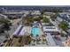 Aerial view of pool with lounge chairs, palm trees, and a building for community enjoyment at 4341 Cordial Aly, North Charleston, SC 29405