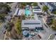 Aerial shot of community swimming pool, palm trees and lounge chairs in a private setting at 4341 Cordial Aly, North Charleston, SC 29405