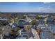 Aerial view of neighborhood, featuring a pool and surrounding homes with various roof colors at 4341 Cordial Aly, North Charleston, SC 29405