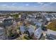 An aerial view of a residential neighborhood showcasing rooftops and tree-lined streets at 4341 Cordial Aly, North Charleston, SC 29405