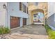 Exterior view of a home showcasing garages and a charming courtyard at 4341 Cordial Aly, North Charleston, SC 29405