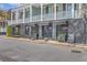 Attractive commercial building featuring a modern design with sleek black finishes and large windows at 4341 Cordial Aly, North Charleston, SC 29405