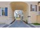 Cobblestone drive under archway with house view at 4341 Cordial Aly, North Charleston, SC 29405