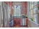 Charming kitchen featuring dark wood cabinets, stainless steel appliances, and a bright window at 4341 Cordial Aly, North Charleston, SC 29405