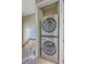 A modern stacked washer and dryer unit conveniently located near the staircase at 4341 Cordial Aly, North Charleston, SC 29405