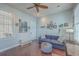 View of the living room with sofa, ottoman, and lots of natural light at 4341 Cordial Aly, North Charleston, SC 29405