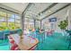 Bright market interior featuring retractable doors, various seating options, and plants at 4341 Cordial Aly, North Charleston, SC 29405