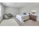 Comfortable bedroom featuring a full-size bed, nightstand, and stylish armchair at 4497 Ocean Farm Dr, Summerville, SC 29485