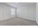 Bright bedroom with neutral carpet, a single window with blinds, and white walls and trim at 4497 Ocean Farm Dr, Summerville, SC 29485