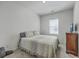 Bright bedroom with carpet, a window with blinds, and a neutral comforter with decorative pillows at 4497 Ocean Farm Dr, Summerville, SC 29485