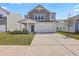 Charming two-story home featuring a two-car garage and manicured front lawn at 4497 Ocean Farm Dr, Summerville, SC 29485