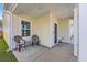 Inviting front porch featuring seating and stylish decor at 4497 Ocean Farm Dr, Summerville, SC 29485