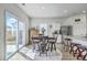 Sunlit kitchen dining area featuring modern appliances and easy access to patio at 4497 Ocean Farm Dr, Summerville, SC 29485