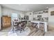 Bright kitchen and dining area with stainless steel appliances and stylish barstool seating at 4497 Ocean Farm Dr, Summerville, SC 29485