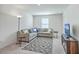 Cozy living room features a comfortable sectional sofa, area rug, and a television at 4497 Ocean Farm Dr, Summerville, SC 29485