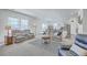 Spacious living room with plush seating and views of the open kitchen at 4497 Ocean Farm Dr, Summerville, SC 29485