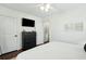 Bedroom featuring a dresser, television, and ensuite access at 51 Gadsden St # B, Charleston, SC 29401