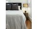 Comfortable bedroom featuring a cushioned headboard and decorative side table at 51 Gadsden St # B, Charleston, SC 29401